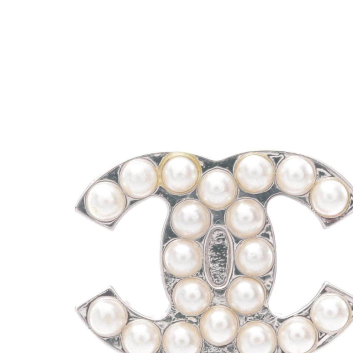 Chanel Coco Mark Brass Earrings – close-up